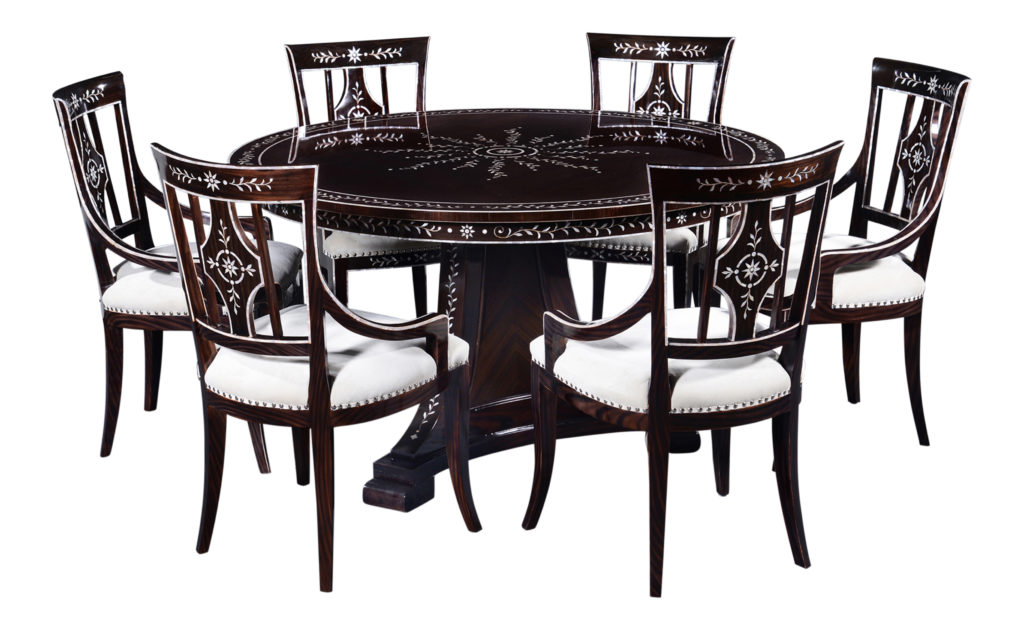 Mother of pearl furniture. Dining set with circular table and six chairs with a mahogany frame and Macassar ebony veneer and mother-of-pearl inlay.